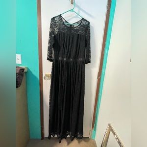 Floor length black dress with lace detailing. Size large